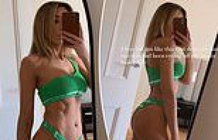 Former football WAG Nadia Bartel shows off her incredible abs as she poses in a ...