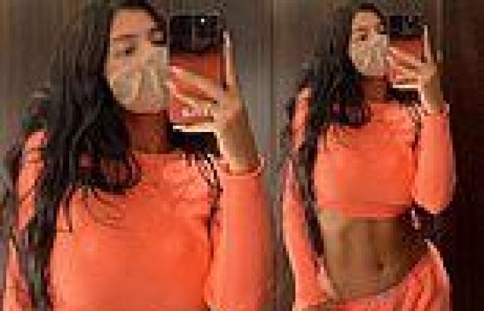 Kylie Jenner shows off midriff in orange crop top and sweats in throwback snap ...