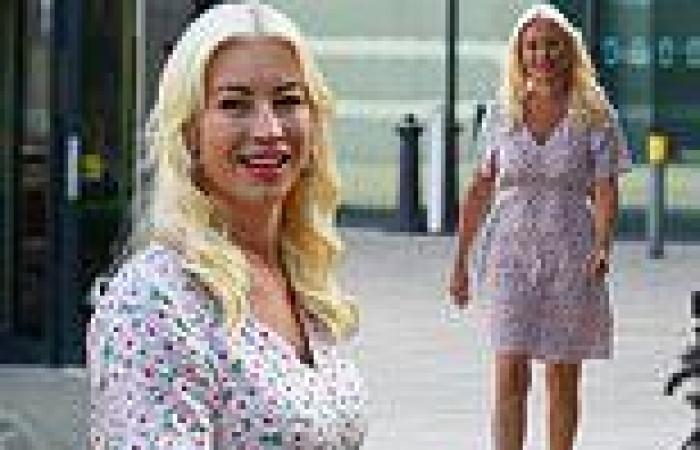 Denise Van Outen beams as she steps out in a low-cut floral dress