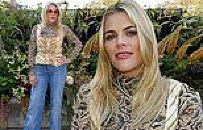 Busy Philipps rocks animal print blouse with jeans at Ulla Johnson show during ...