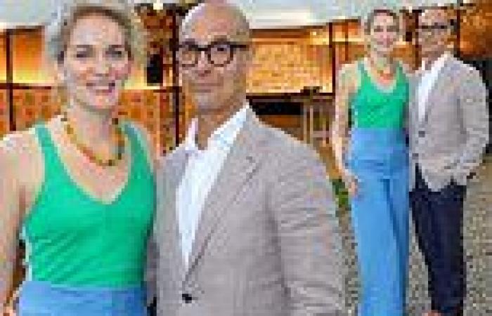 Stanley Tucci looks dapper in a grey jacket as he poses with his stylish wife ...