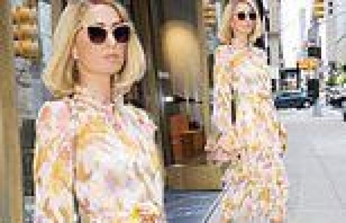 Paris Hilton is the picture of elegance in a floral midi dress during New York ...