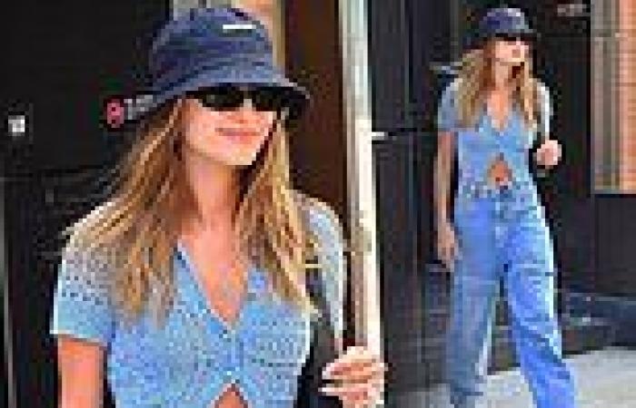 Hailey Bieber flashes her taut midriff in a cute blue crochet cardigan as she ...