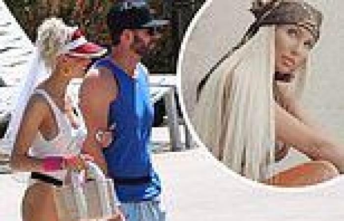 Heather Rae Young flashes major leg in white bathing suit and veil