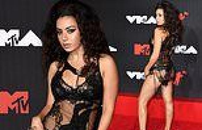 Charli XCX leaves very little to the imagination in a racy sheer black ensemble