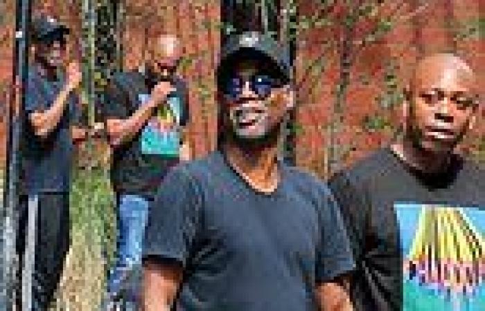Dave Chappelle and Chris Rock laugh it up while standing on a street corner in ...