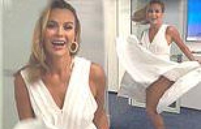 Amanda Holden enjoys a Marilyn Monroe moment as she flashes her legs in a white ...