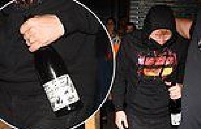 Ed Sheeran clutches a £2600 bottle of wine as he ducks out of Scooter Braun's ...