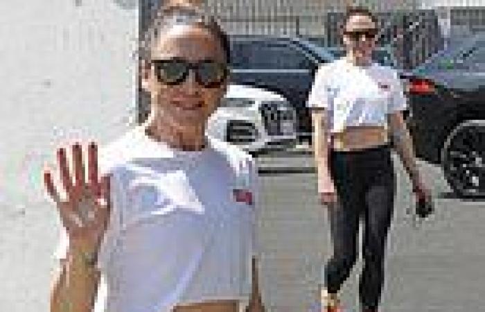 Mel C flashes her taut abs in a white crop top and leggings