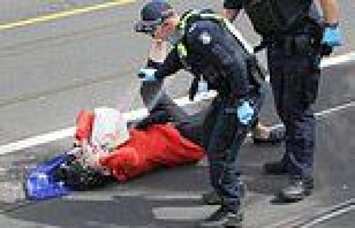 Policemen douse an elderly woman with pepper spray during Melbourne's ...