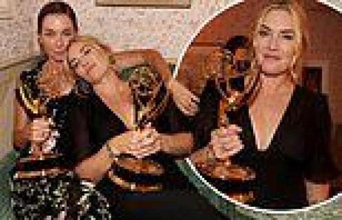 Kate Winslet proudly shows off her trophy as she poses with Julianne Nicholson ...