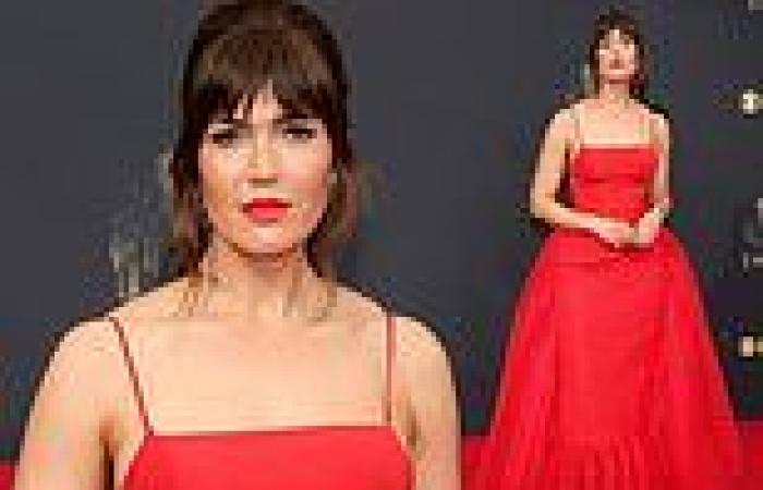 Mandy Moore shows regal style in red Caroline Herrera spaghetti strap gown at ...