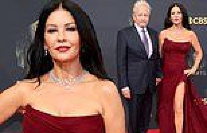 Catherine Zeta-Jones hits the red carpet in a burgundy strapless gown at the ...