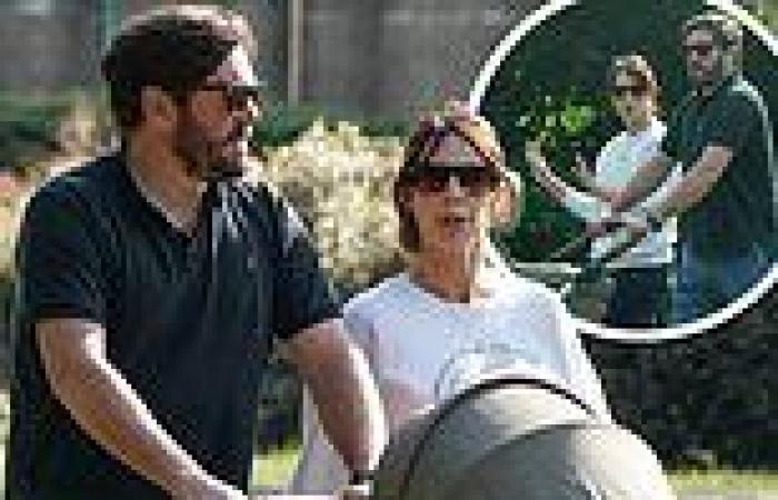 Alex Jones enjoys a relaxing stroll with husband Charlie Thomson and their ...