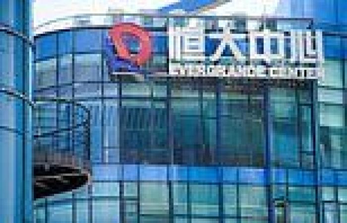 Evergrande strikes deal to calm fears firm will default sparking global ...