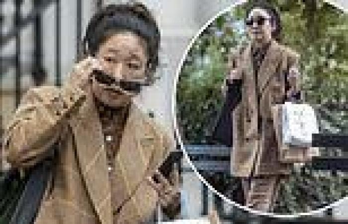 Sandra Oh looks typically chic as she steps out in an oversized brown suit in ...