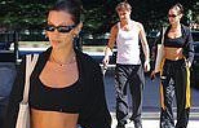 Bella Hadid cuts an athletic figure in a black sports bra while out with ...