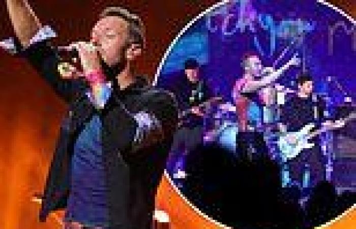 Coldplay storm the stage at New York gig... as Chris Martin struggles with his ...