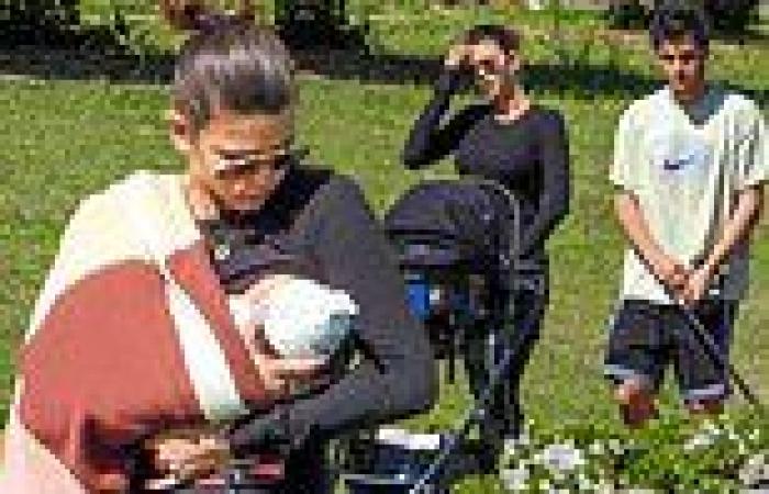 Georgia Fowler and Nathan Dalah enjoy a family outing with their newborn ...