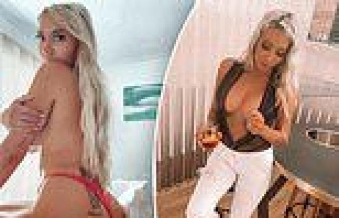 Steve Irwin's 'hot niece' Rebecca Lobie goes topless while posing in her bedroom