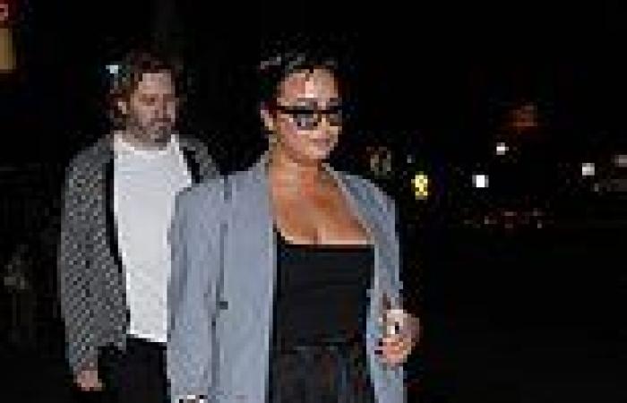 Demi Lovato flashes cleavage in low-cut top as they enjoy a night out at celeb ...