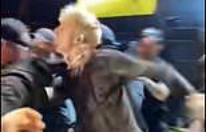 Machine Gun Kelly PUNCHES a rowdy audience member as crowd swarms stage