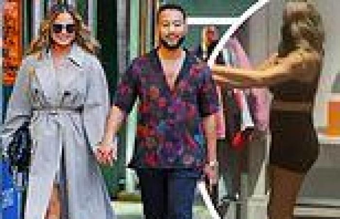 Chrissy Teigen covers up in a trench coat while shopping with John Legend