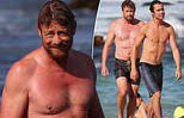 Simon Baker, 52, shows off his abs as he relaxes with son Claude Blue Baker at ...