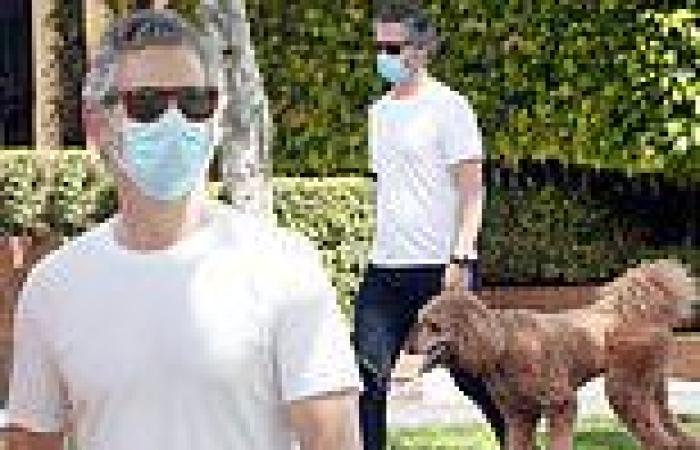 Eric Bana cuts a casual figure as he takes his dog for a stroll around Melbourne