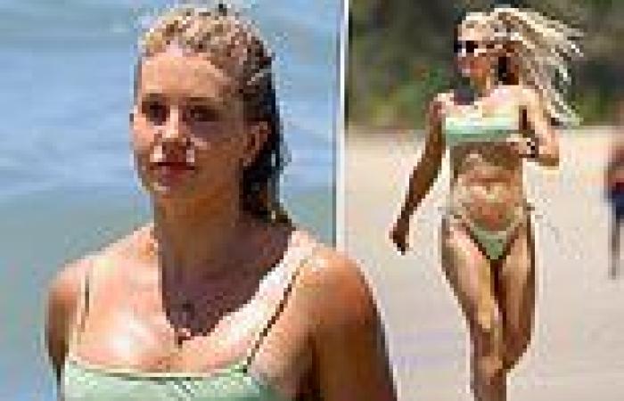 Ali Oetjen looks sensational in a tiny green bikini at the beach