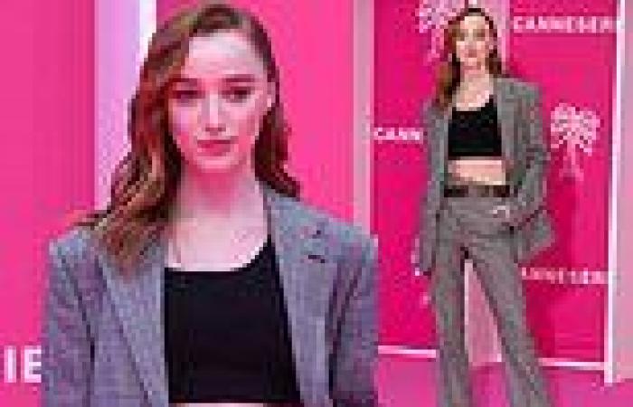 Phoebe Dynevor flashes her toned midriff in a black crop top at the Canneseries