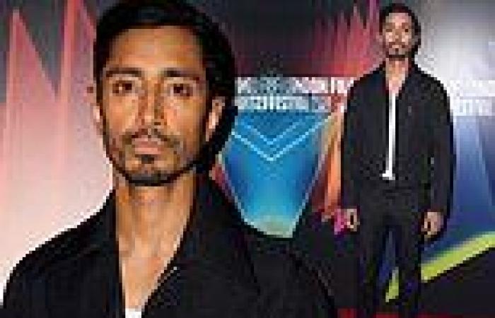 Riz Ahmed looks suave in a black collared zip-up jacket at the premiere of his ...