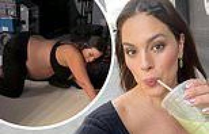 Ashley Graham gets some stretches in and shows off her baby bump before a photo ...