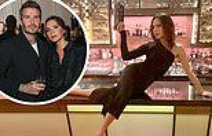 Victoria Beckham catches the eye as she strikes an elegant bar top pose