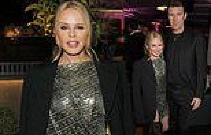 Kylie Minogue looks smitten with boyfriend Paul Solomons at Versace event