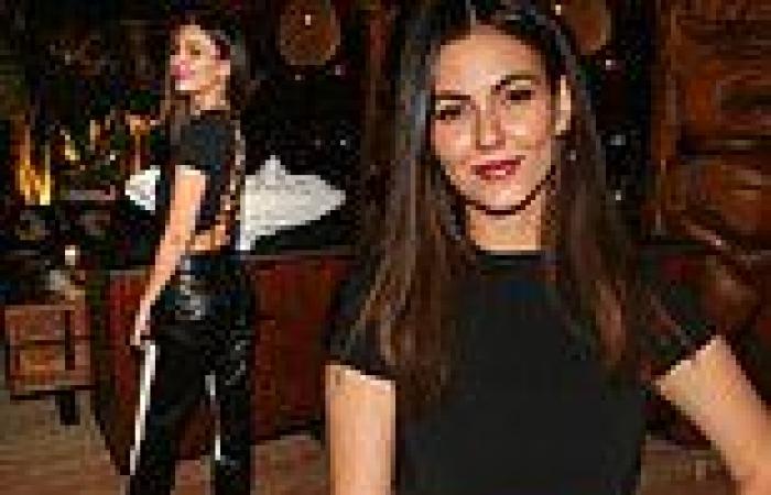 Victoria Justice rocks a backless crop top with black leather slacks for beach ...