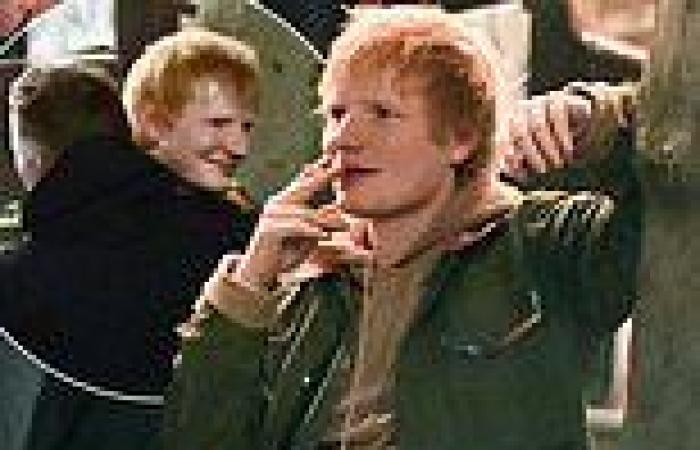 Ed Sheeran puffs on a cigarette and larks around with friends after enjoying ...