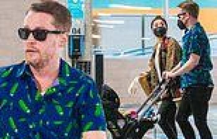 Macaulay Culkin pushes son Dakota in a stroller while picking up groceries with ...