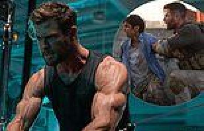 Chris Hemsworth shows off his huge bulging biceps as he gets into shape for ...