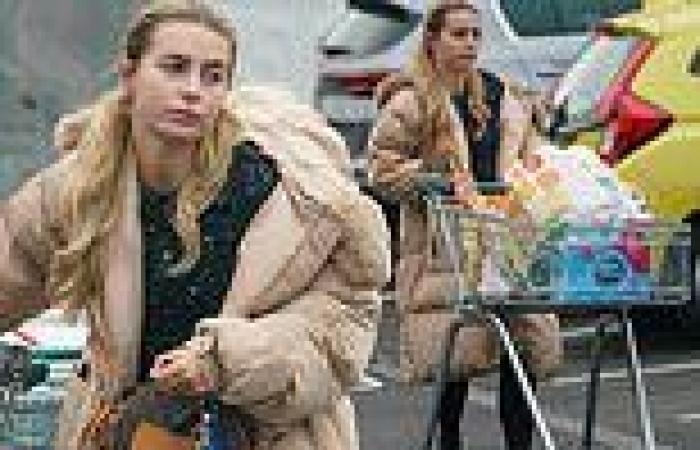 Dani Dyer goes make-up free as she dons a huge puffer jacket while food shopping