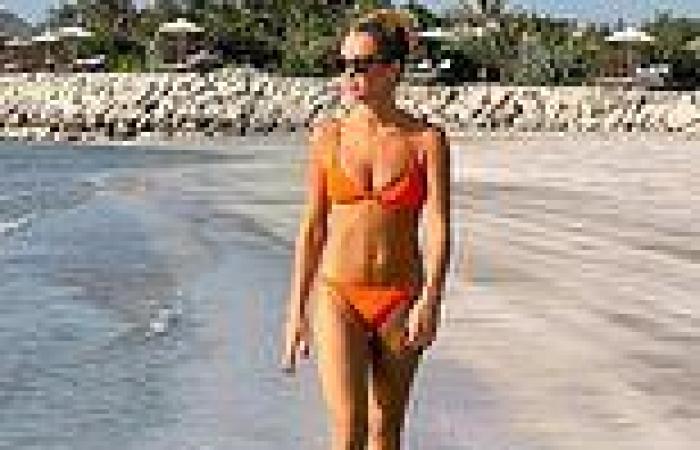 Amanda Holden sizzles in a skimpy orange bikini as she enjoys idyllic beach ...