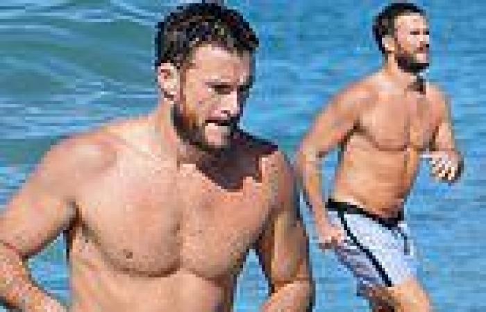 Scott Eastwood shows off his shirtless, buff body in swim trunks as he's seen ...