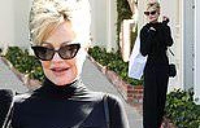 Melanie Griffith showcases her figure in a sleek black top while shopping in ...