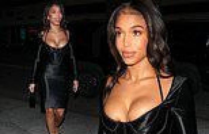 Lori Harvey showcases her ample cleavage in low-cut black corset dress in West ...