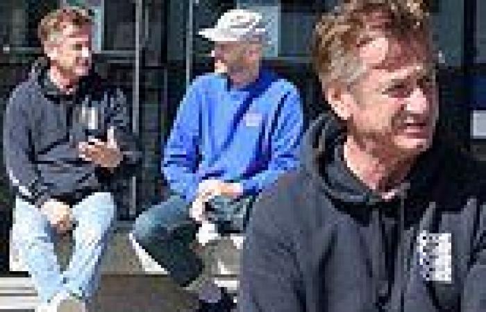 Sean Penn, 61, enjoys chitchat with male pal on bench