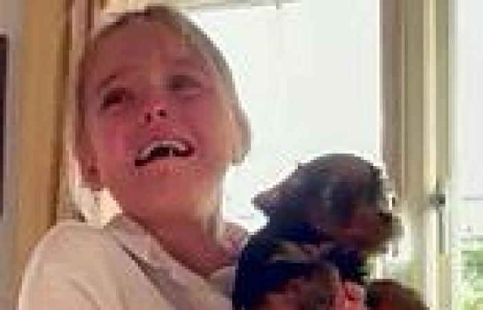 Puppy love! Moment girl, 9, bursts into tears of joy when her mother surprises ...