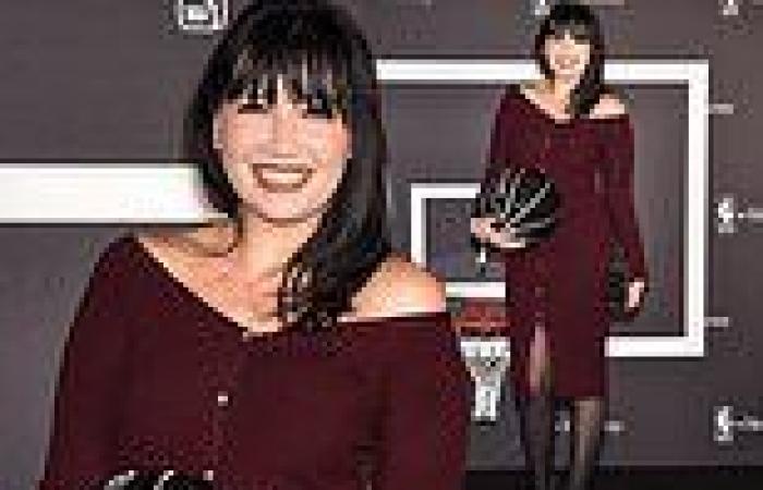 Daisy Lowe wows in a figure-hugging knitted dress as she cradles diamante ...