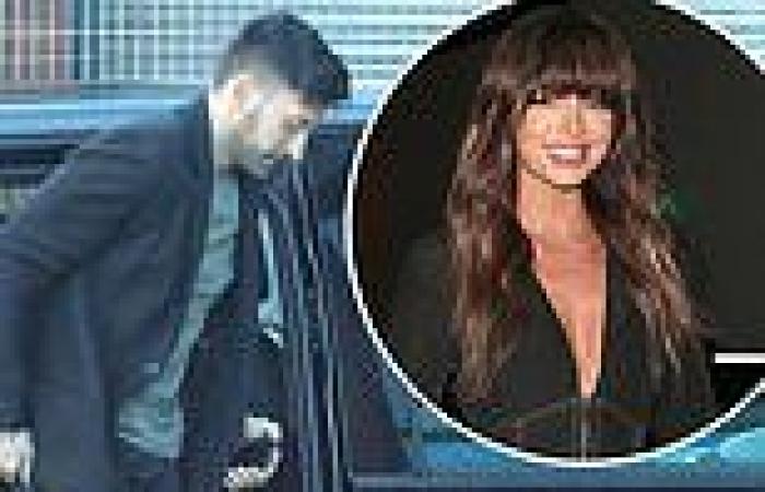Giovanni Pernice cuts a black wool coat as he attends Strictly rehearsals with ...