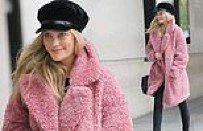 Laura Whitmore dons a pink coat and an edgy black cap as she arrives at her BBC ...