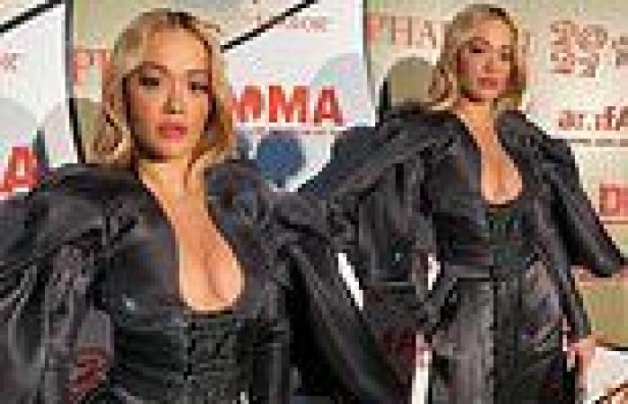 Rita Ora puts on a busty display in black ensemble with plunging neckline and ...